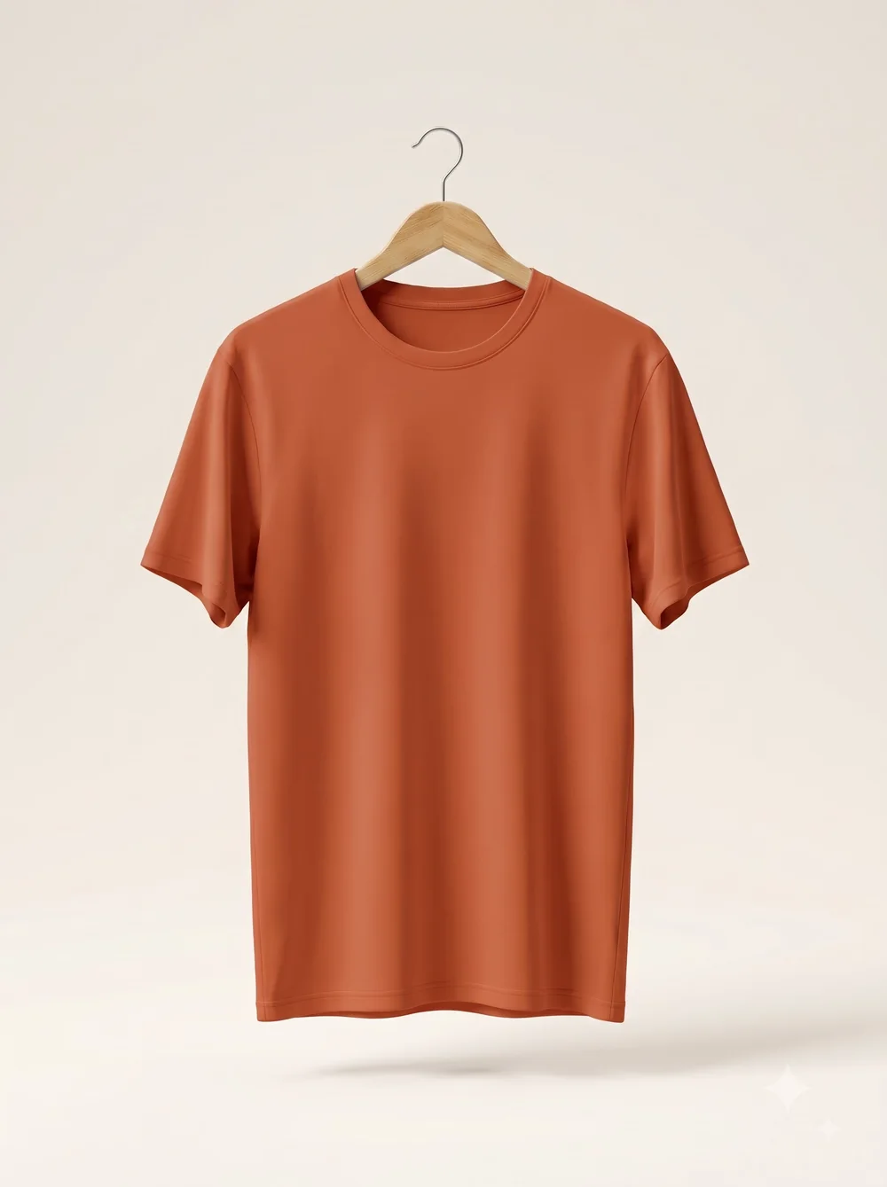 Blank terracotta t-shirt on a wooden hanger